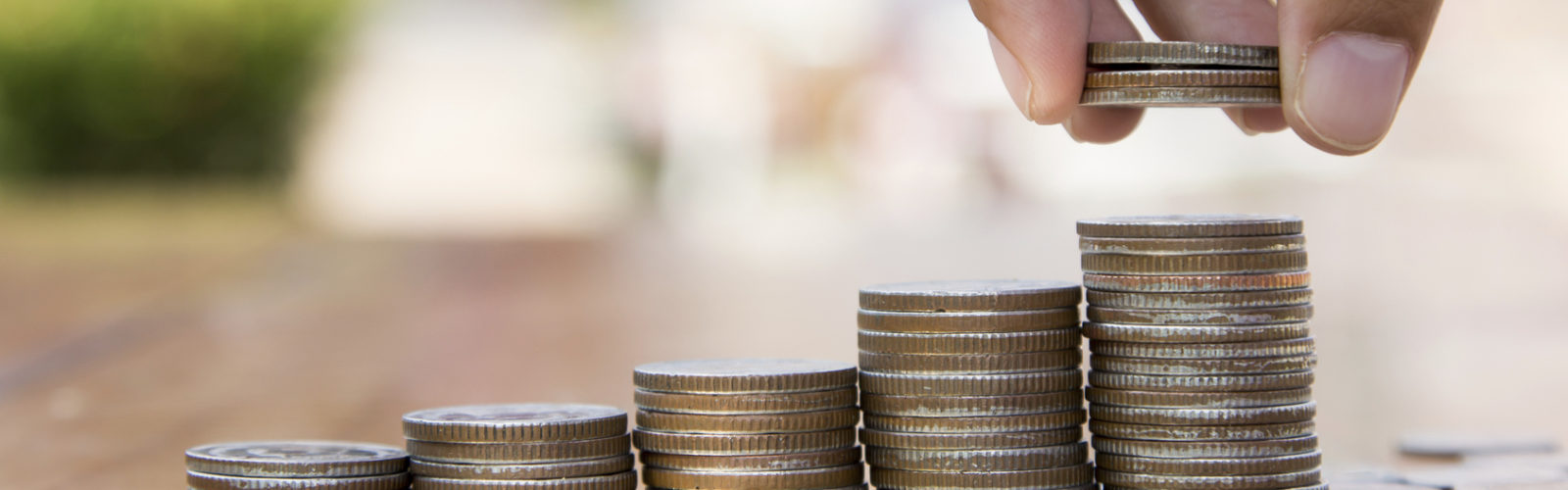 hand holding coins