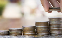 hand holding coins