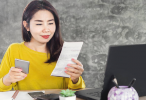 A Woman Paying Her Bills